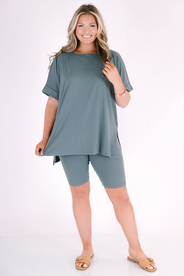 Plus Size ash jade short set with a round neck, high-low hem top and matching biker shorts.