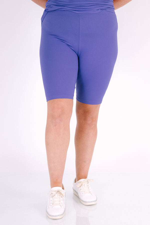 Plus Size marlin blue short set with a round neck high-low top and matching biker shorts.