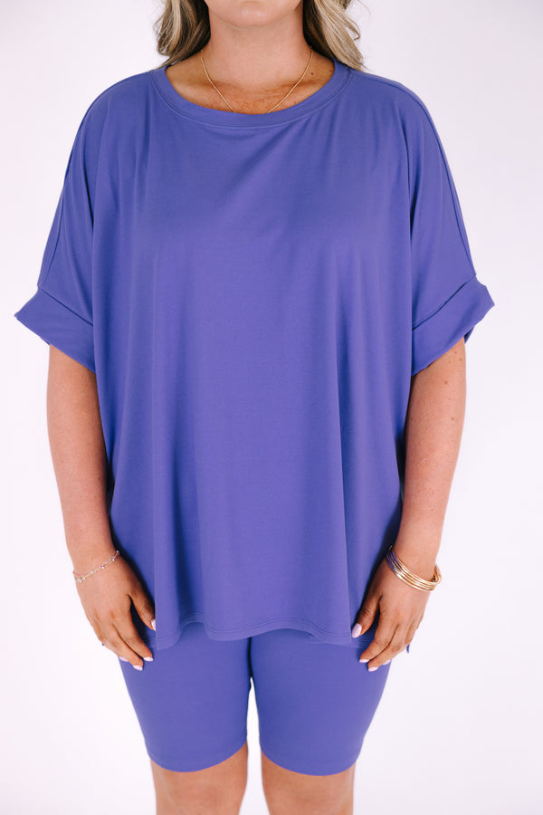 Plus Size marlin blue short set with a round neck high-low top and matching biker shorts.