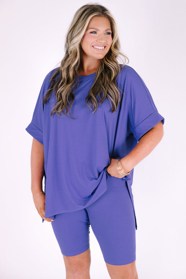 Plus Size marlin blue short set with a round neck high-low top and matching biker shorts.