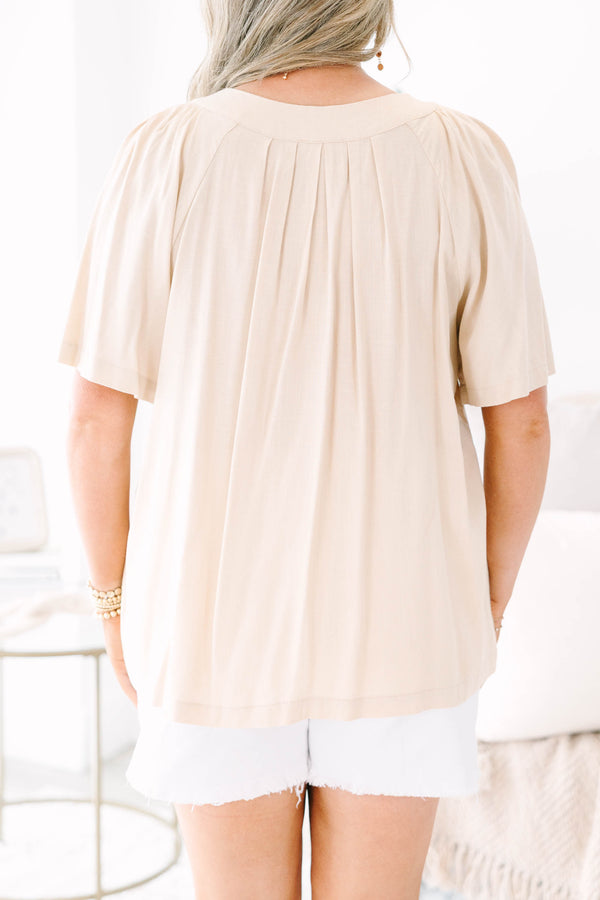 Plus Size taupe rayon linen blend top with a v-neckline, short sleeves, and pleated front detail.