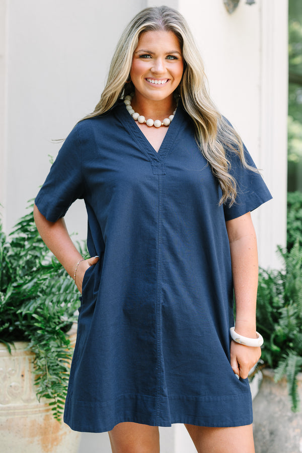 Chic Soul Plus Size Clothing, a short navy blue dress with short sleeves and a collared V-neck. Features side-seam pockets. 
