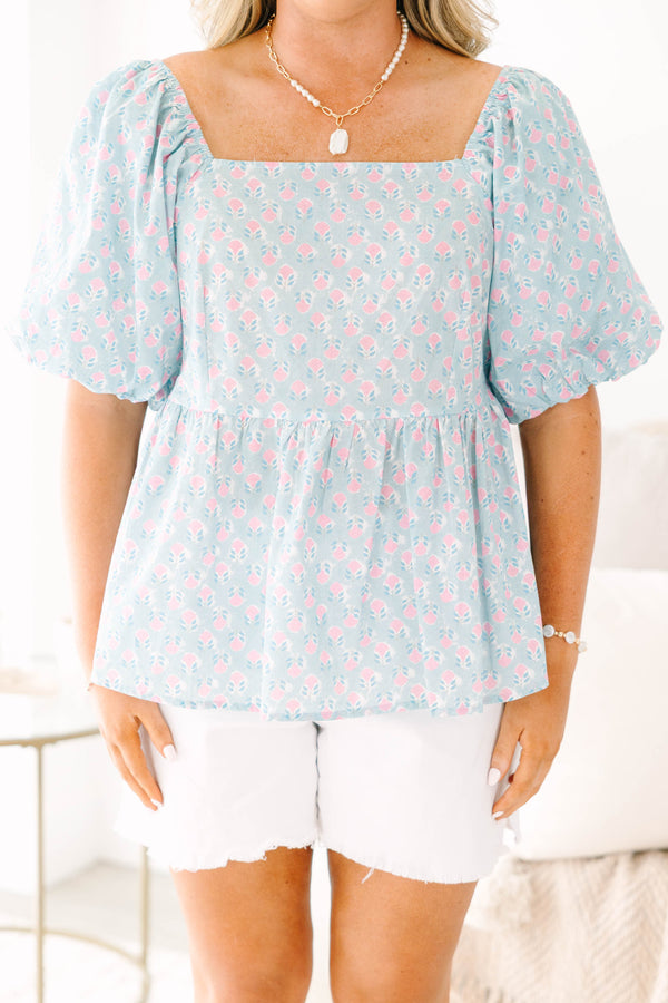 Chic Soul plus size clothing, a peplum style top in a primarily blue with pink floral print and puff sleeves
