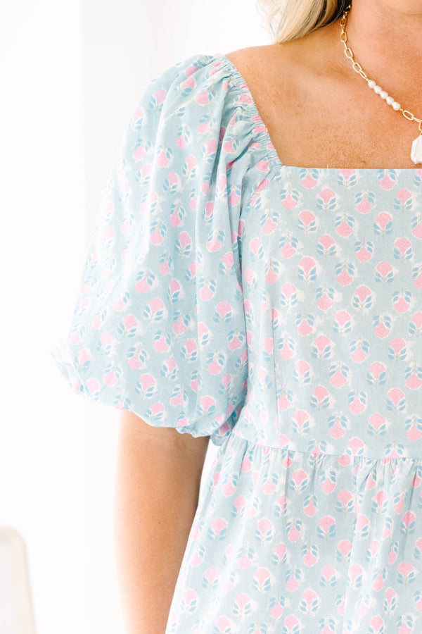 Chic Soul plus size clothing, a peplum style top in a primarily blue with pink floral print and puff sleeves