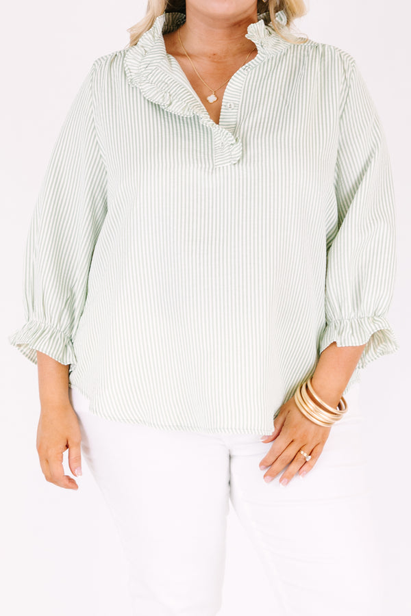 Chic Soul plus size clothing, green striped top with half sleeves that have ruffles at the end of each sleeve as well as ruffle detailing going along the collar and down the v-neckline