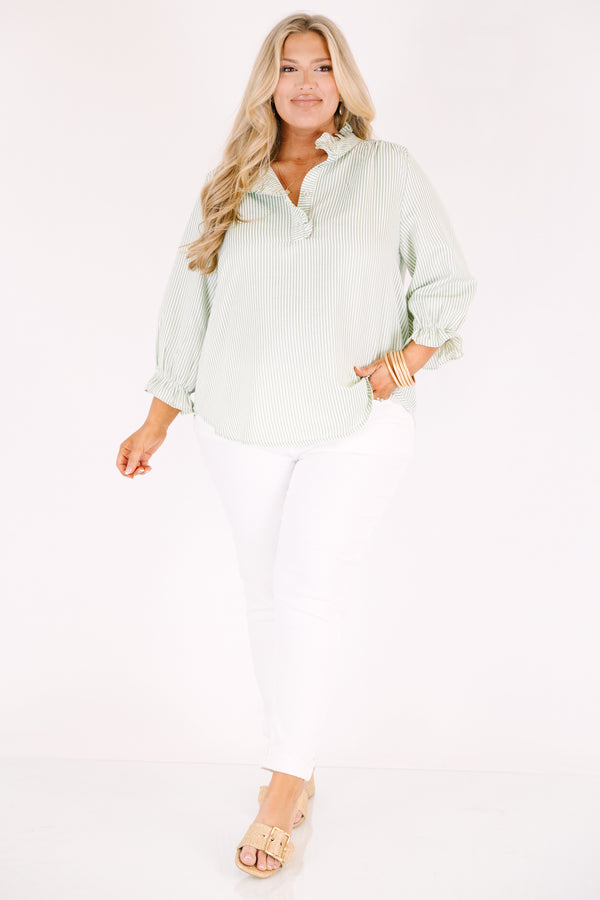 Chic Soul plus size clothing, green striped top with half sleeves that have ruffles at the end of each sleeve as well as ruffle detailing going along the collar and down the v-neckline
