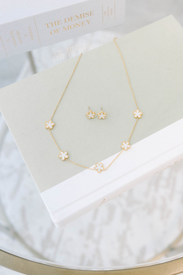 Plus Size gold-toned necklace and earring set featuring delicate cream-colored floral charms.