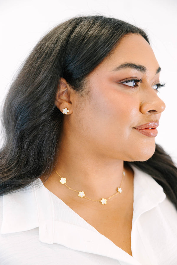 Plus Size gold-toned necklace and earring set featuring delicate cream-colored floral charms.