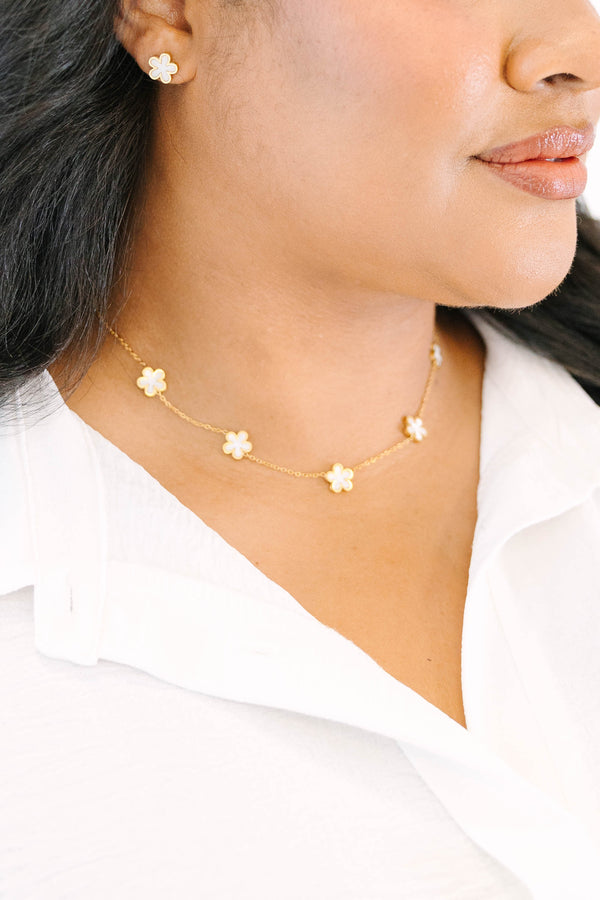 Plus Size gold-toned necklace and earring set featuring delicate cream-colored floral charms.