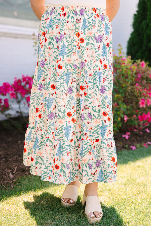 Chic soul plus size clothing, tiered, cream-colored floral whimsy skirt with a colorful wildflower print.