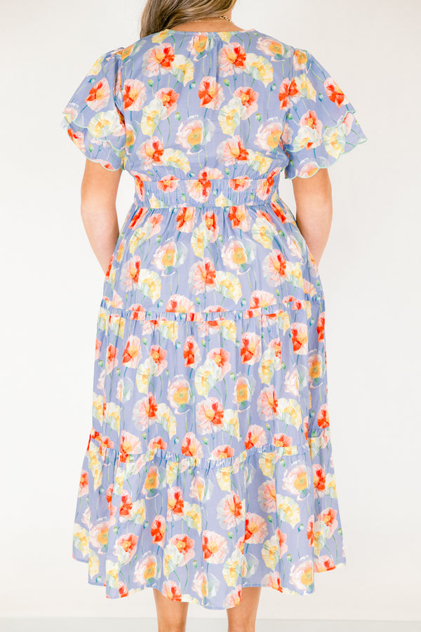 Chic Soul plus size clothing, blue tiered maxi dress with flutter sleeves that have two scalloped ruffle as well as sinching waistband a slight v-neckline and multi color flora pattern throughout 
