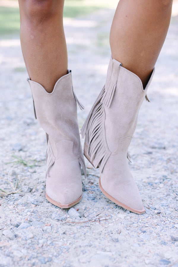 Plus Size beige suede pointed-toe ankle boots with long fringe detailing and a stacked heel.