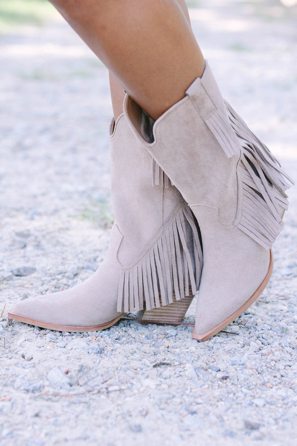 Plus Size beige suede pointed-toe ankle boots with long fringe detailing and a stacked heel.