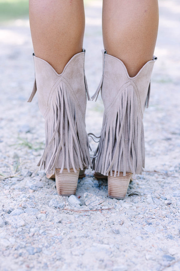 Plus Size beige suede pointed-toe ankle boots with long fringe detailing and a stacked heel.