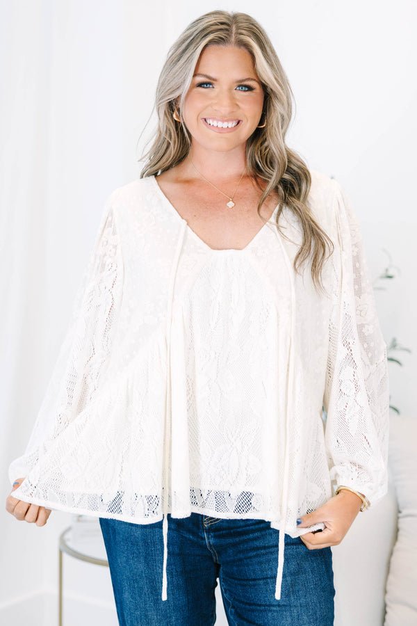 Plus Size cream lace top with long balloon sleeves, a V-neckline, and tie details.