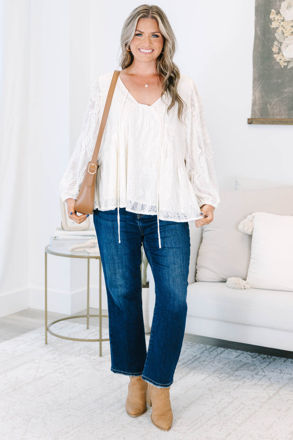 Plus Size cream lace top with long balloon sleeves, a V-neckline, and tie details.