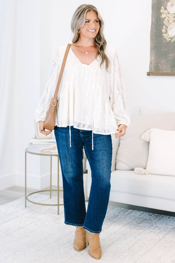Plus Size cream lace top with long balloon sleeves, a V-neckline, and tie details.