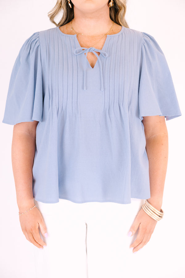 Chic Soul plus size clothing, light dusty blue short flutter sleeve top with v neck cutout and a drawstring bow tying across the cutout
