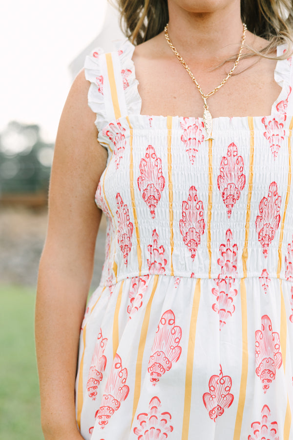 Plus Size white midi dress with pink block print patterns, yellow stripes, and a smocked bodice.