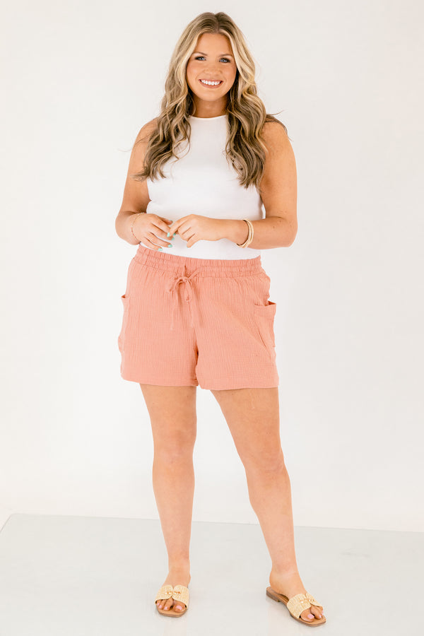 Chic Soul plus size clothing, rose colored lien shorts with pocket on the side of each short leg and a draw string waistband that has a bow that ties in the middle of the shorts 