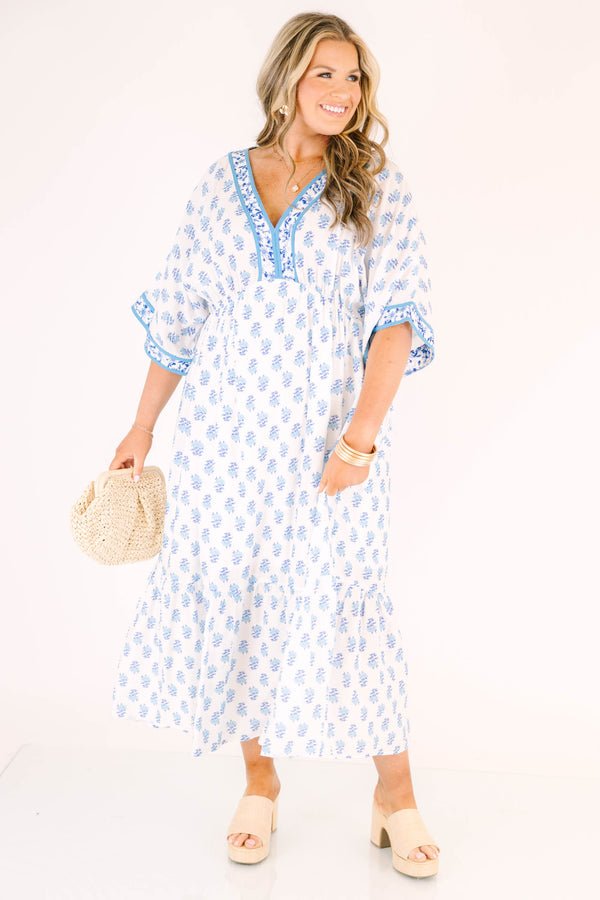 Chic Soul plus size clothing, cerulean blue maxi dress with short sleeves that have a floral pattern cuffed as well as a floral pattern outlining the v-neckline and a floral block pattern throughout