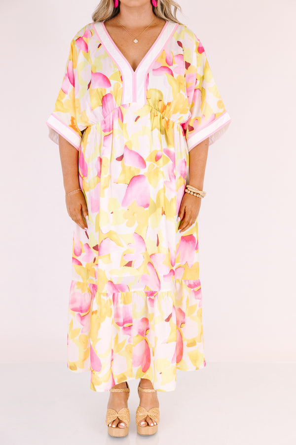 Chic Soul plus size clothing, white maxi dress with half sleeves and a yellow and fuchsia floral pattern throughout as well as pink outlining the v-neckline and end of the sleeves 