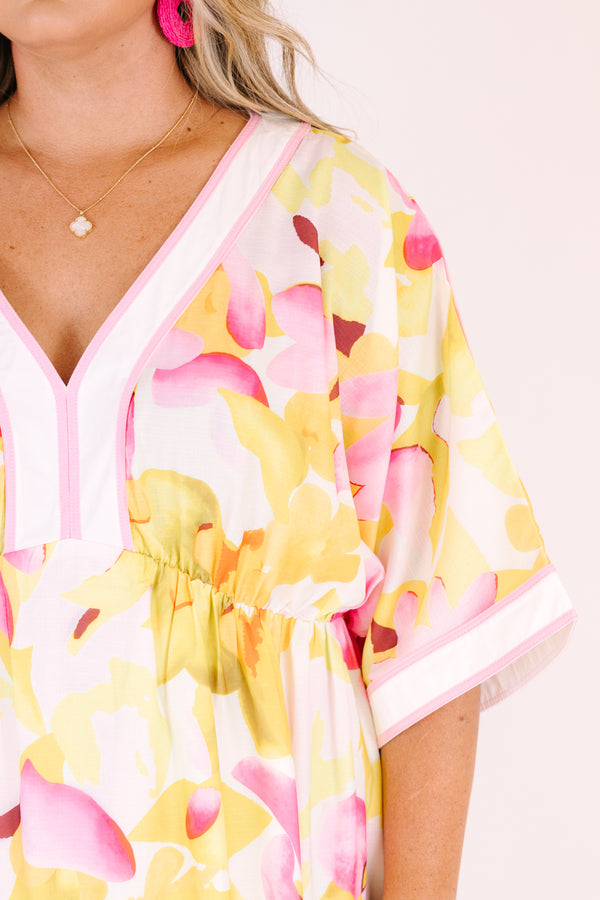 Chic Soul plus size clothing, white maxi dress with half sleeves and a yellow and fuchsia floral pattern throughout as well as pink outlining the v-neckline and end of the sleeves 