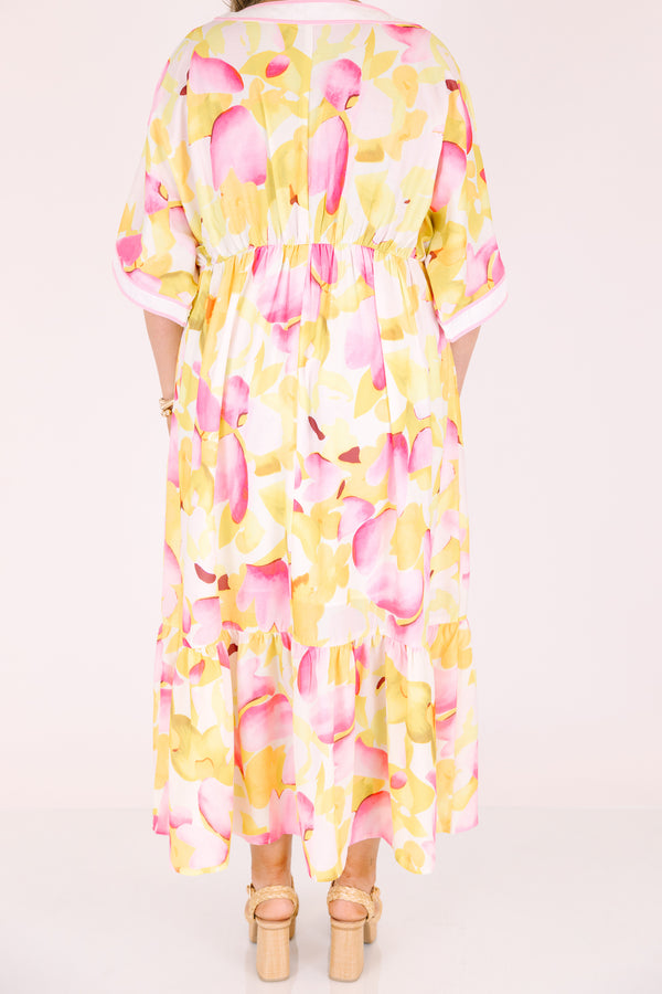 Chic Soul plus size clothing, white maxi dress with half sleeves and a yellow and fuchsia floral pattern throughout as well as pink outlining the v-neckline and end of the sleeves 