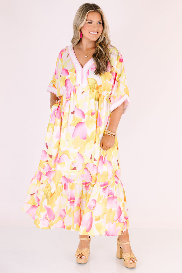 Chic Soul plus size clothing, white maxi dress with half sleeves and a yellow and fuchsia floral pattern throughout as well as pink outlining the v-neckline and end of the sleeves 