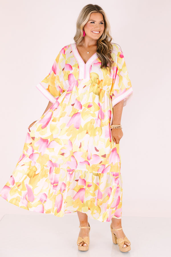 Chic Soul plus size clothing, white maxi dress with half sleeves and a yellow and fuchsia floral pattern throughout as well as pink outlining the v-neckline and end of the sleeves 