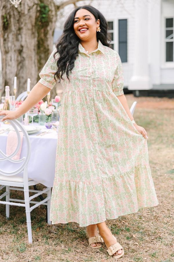 Chic Soul plus size clothing,  pink floral button up maxi dress with short sleeves that have cuffs at each end as well as a collar and a pink and green floral pattern throughout