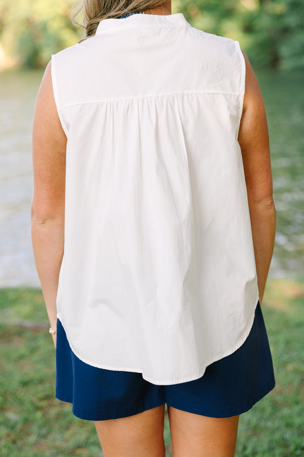 Plus Size white sleeveless button-down tank with a mandarin collar and navy blue shorts.