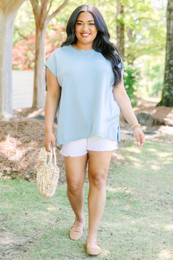 Plus Size light blue cap sleeve knit sweater with a round neckline and side slits.