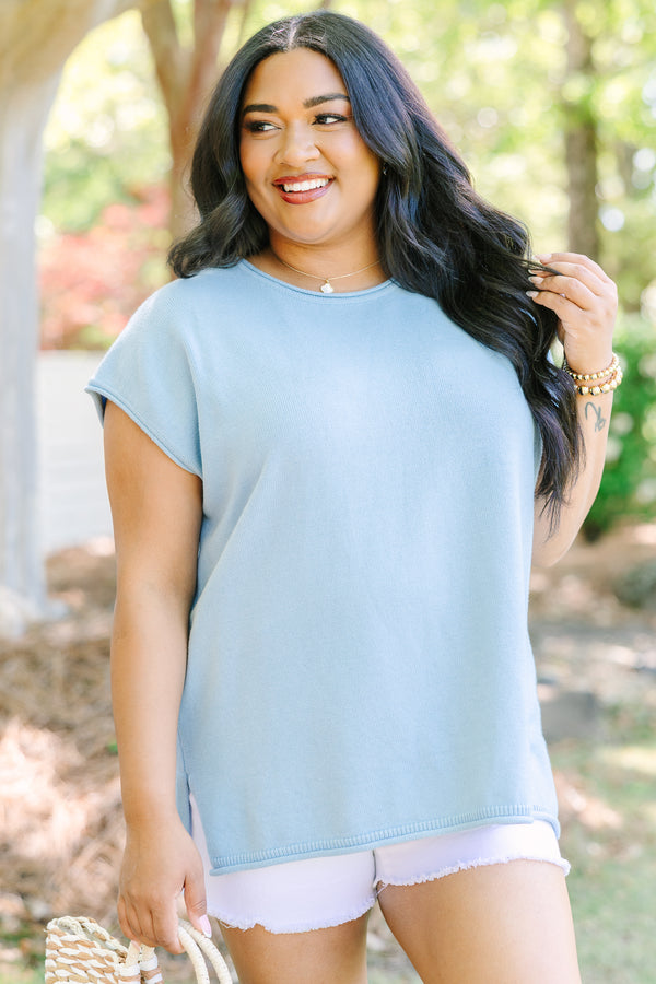 Plus Size light blue cap sleeve knit sweater with a round neckline and side slits.