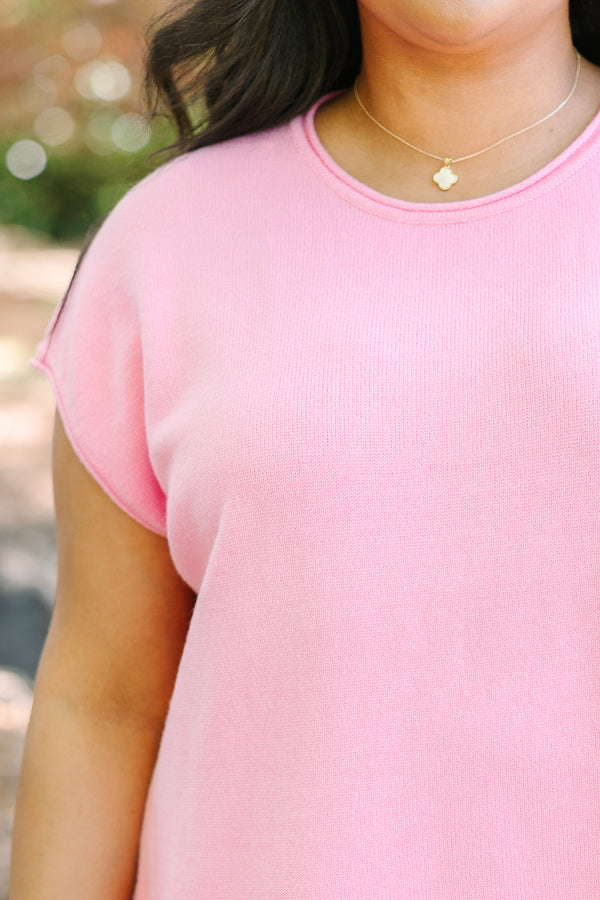 Plus size lightweight pink knit sweater with cap sleeves and a relaxed fit.