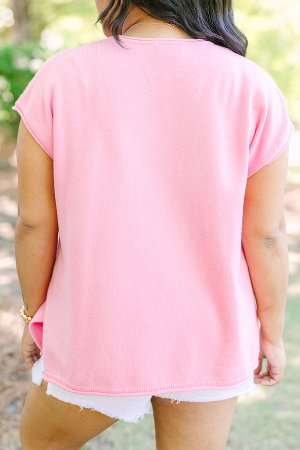Plus size lightweight pink knit sweater with cap sleeves and a relaxed fit.