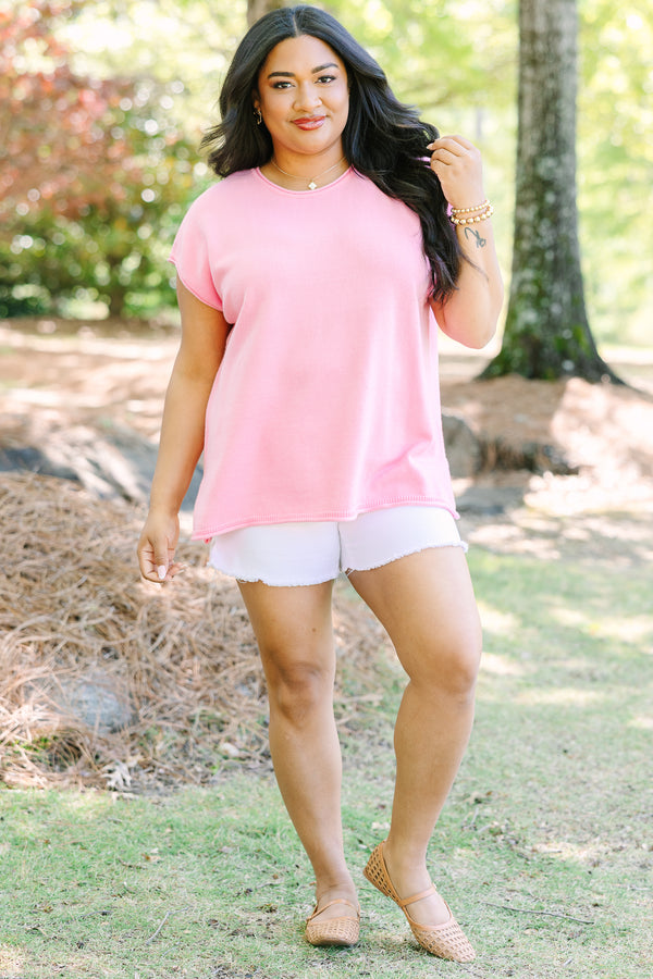 Plus size lightweight pink knit sweater with cap sleeves and a relaxed fit.