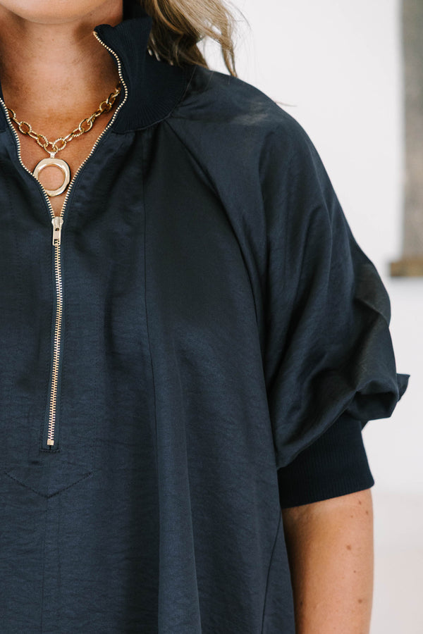 Plus size navy blue half-zip top with a flowy fit, short sleeves, and a gold zipper detail.