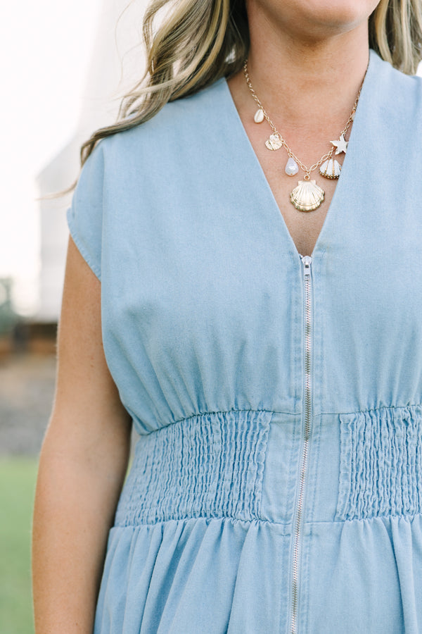 Plus Size light wash denim midi dress with a zip-front, V-neckline, and smocked waist.