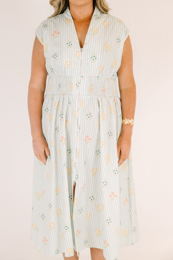 Chic Soul plus size clothing, light blue striped short sleeve maxi dress with with a zipper detail starting at the middle of the chest and going down to the knee as well as cinched stretchy waistband and a floral pattern throughout
