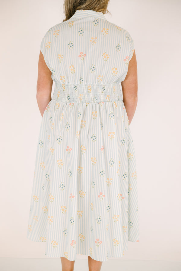 Chic Soul plus size clothing, light blue striped short sleeve maxi dress with with a zipper detail starting at the middle of the chest and going down to the knee as well as cinched stretchy waistband and a floral pattern throughout