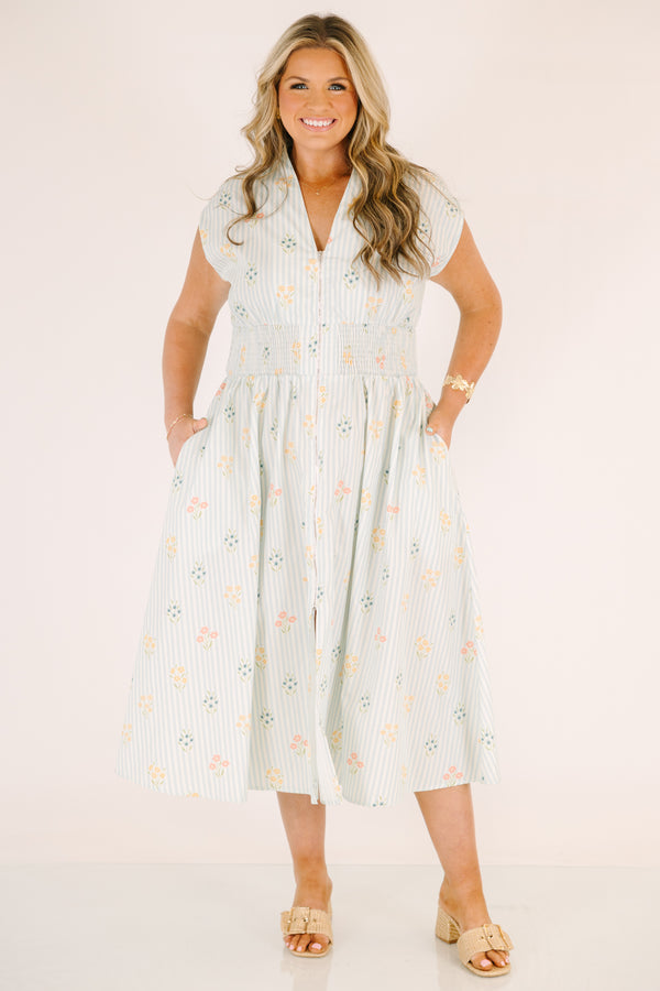Chic Soul plus size clothing, light blue striped short sleeve maxi dress with with a zipper detail starting at the middle of the chest and going down to the knee as well as cinched stretchy waistband and a floral pattern throughout