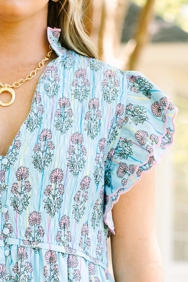 Chic Soul plus size clothing, blue midi dress with futter sleeves and a deep v-neckline as well as a pink floral block pattern throughout 

