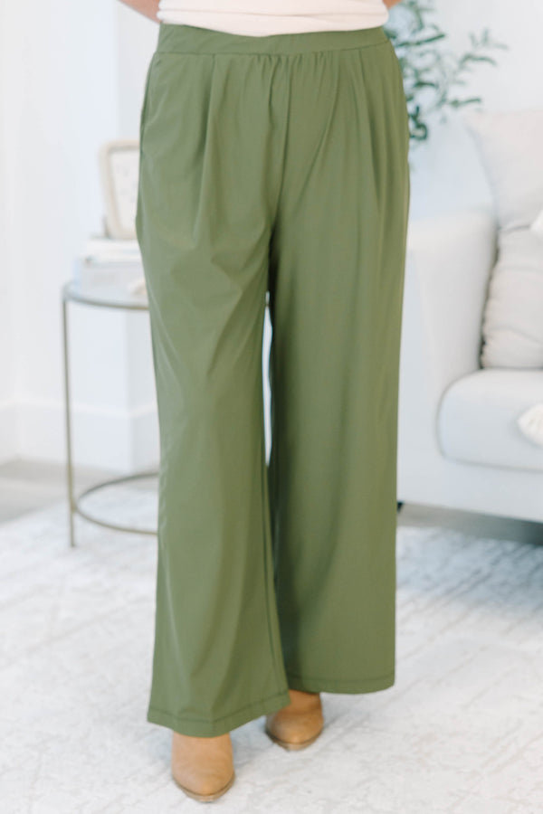 Plus size khaki green wide-leg pants with a flowy fit and stretchy, lightweight fabric.