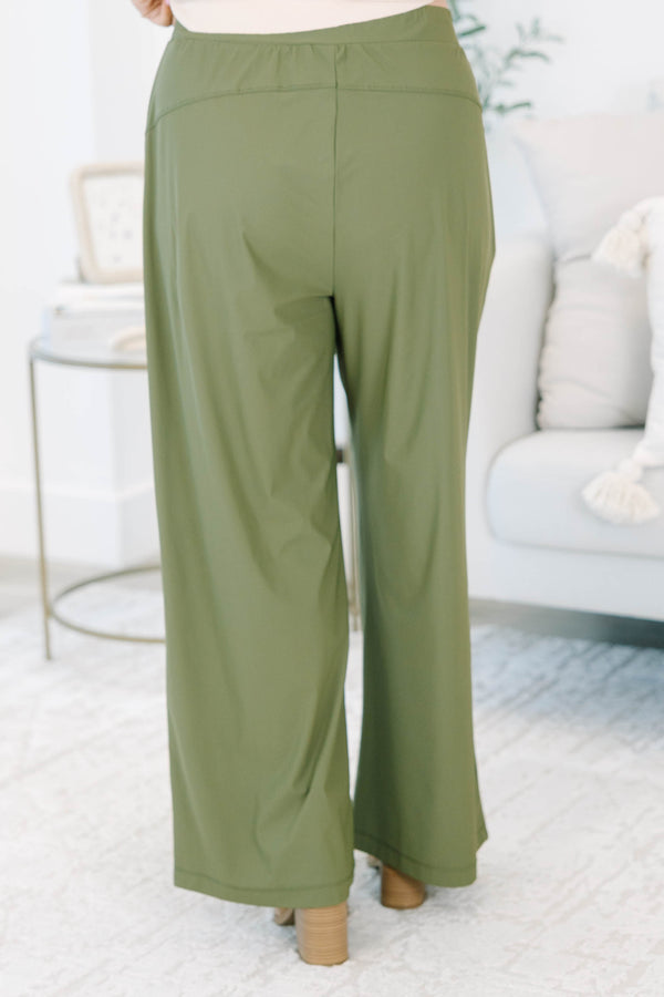 Plus size khaki green wide-leg pants with a flowy fit and stretchy, lightweight fabric.