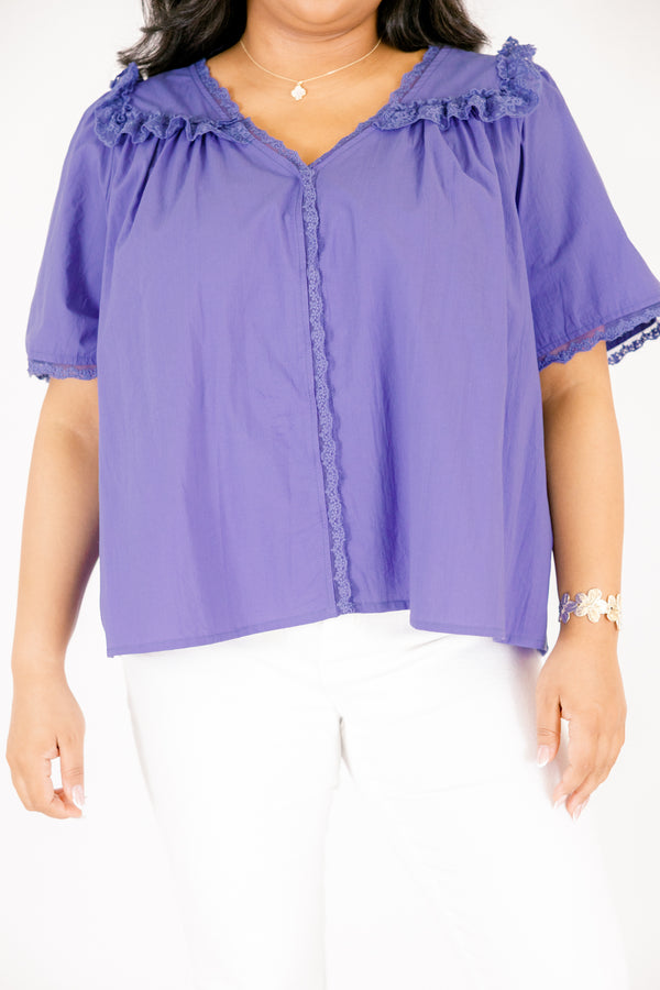 Chic Soul plus size clothing, blue short sleeve top featuring a ruffle bib on the shoulders lace details down the center and lace trim along the ends of each sleeve and the shoulder ruffle