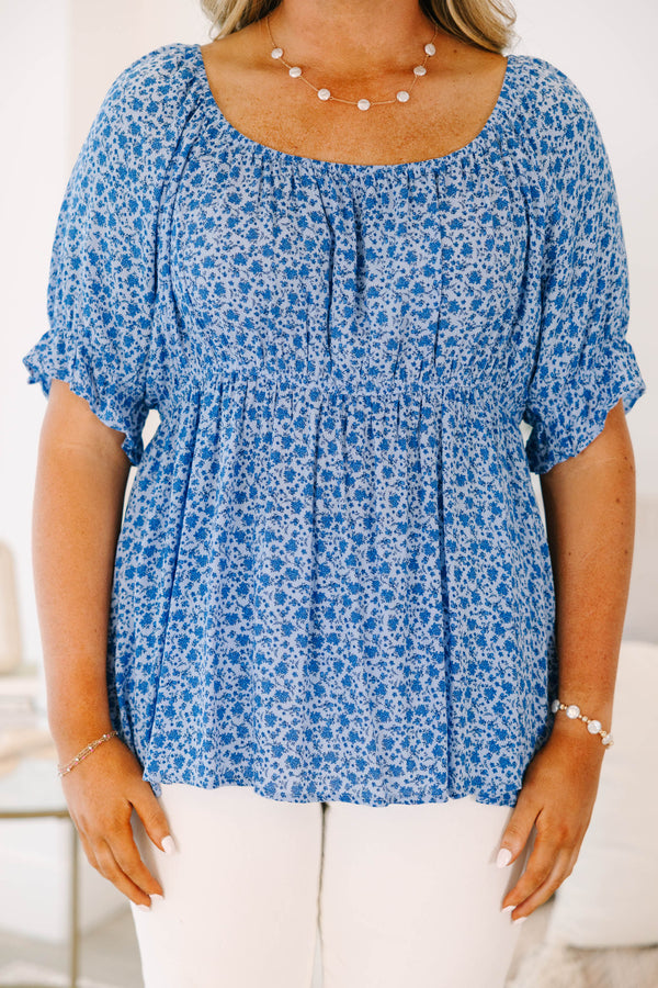 Chic Soul plus size clothing, short-sleeve blue top with smocked waistline and blue and white floral pattern detailing