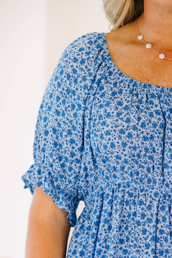 Chic Soul plus size clothing, short-sleeve blue top with smocked waistline and blue and white floral pattern detailing