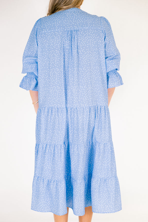 Chic Soul plus size clothing, blue midi sleeve midi dress with cinching at the end of the sleeves, a tiered skirt, and a v-neckline with small white polka dots throughout the dress