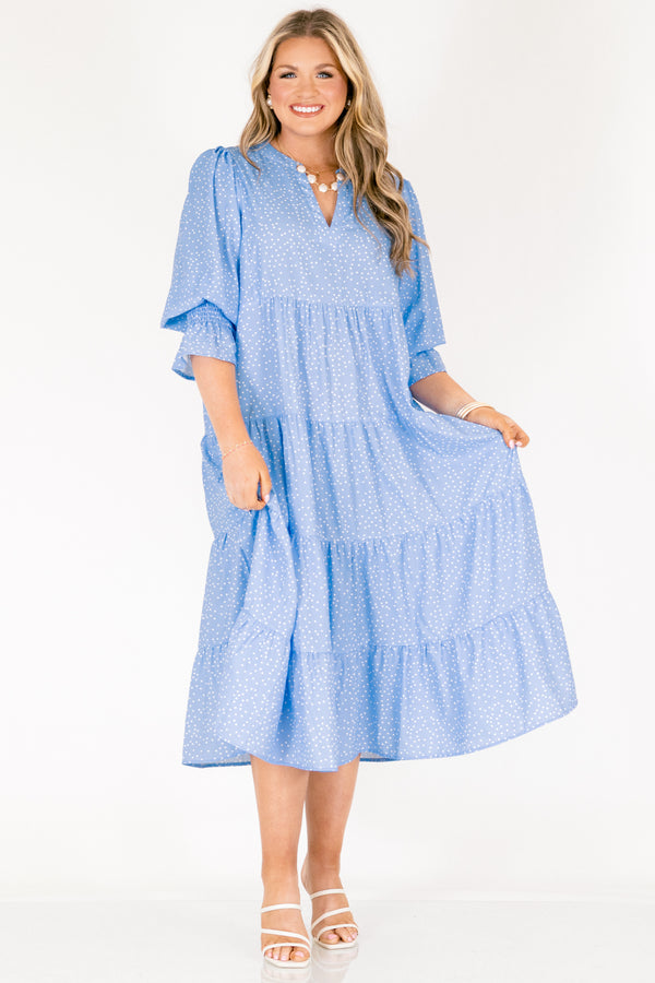 Chic Soul plus size clothing, blue midi sleeve midi dress with cinching at the end of the sleeves, a tiered skirt, and a v-neckline with small white polka dots throughout the dress
